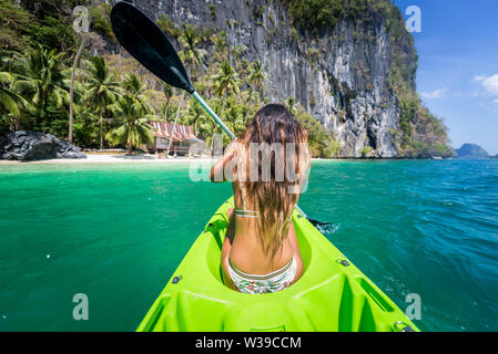 Woman kayaking in the Small Lagoon in Palawan  - El Nido, Palawan, Philippines Stock Photo