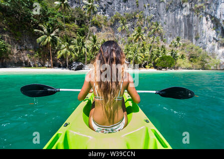 Woman kayaking in the Small Lagoon in Palawan  - El Nido, Palawan, Philippines Stock Photo