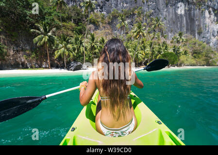 Woman kayaking in the Small Lagoon in Palawan  - El Nido, Palawan, Philippines Stock Photo