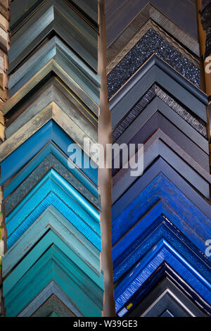 Rows of sample picture frames in a custom picture framing shop Stock Photo