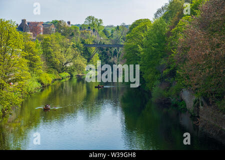 Durham, United Kingdom - April 30, 2019: Beautiful spring scene of people rowing in boats along River Wear in Durham, United Kingdom Stock Photo