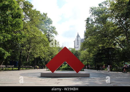 12 July 2019, US, New York: In a New York park, a large sculpture exhibition by the 104-year-old artist Carmen Herrera is on view for the first time in the open air. Five aluminium sculptures about two metres high and up to 3.5 metres wide, each in a luminous colour, will be on display until 8 November in the middle of Manhattan in City Hall Park in front of the city hall of the metropolis. The exhibition 'Carmen Herrea: Estructuras Monumentales' was organized by the Public Art Fund, which takes care of art in public space. Photo: Christina Horsten/dpa - ATTENTION: Only for editorial use in co Stock Photo