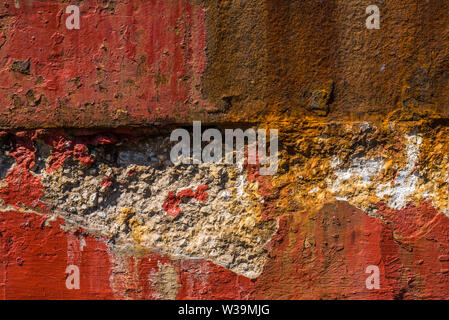 Old, worn, weathered, red painted, rusted concrete. Stock Photo