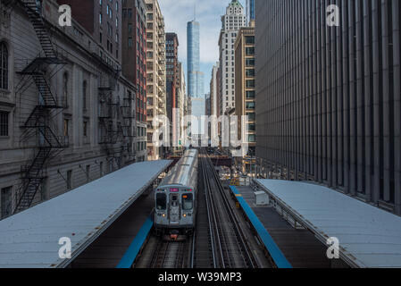 view of Chicago EL train and trump tower from adams/Wabash station Stock Photo