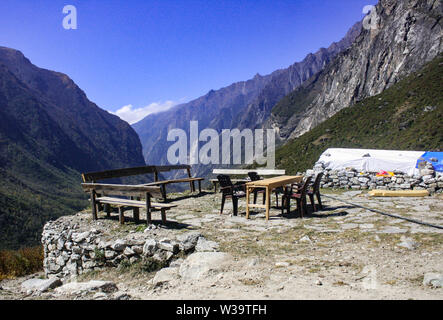 Langtang valley is situated between black rocky mountains but the landscape has a stunning view. Stock Photo