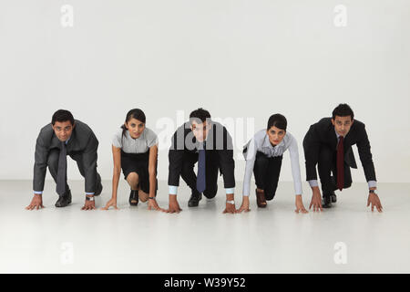 Business executives in starting position Stock Photo