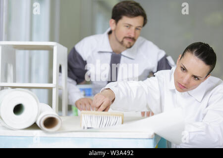 a painter with an apprentice Stock Photo
