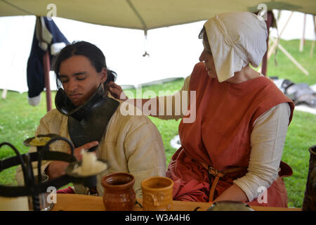 Medieval re-renactors attend the Tewkesbury Medieval Festival at Tewkesbury Battlefield in Gloucestershire. Stock Photo