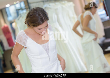 woman fitting a wedding gown Stock Photo