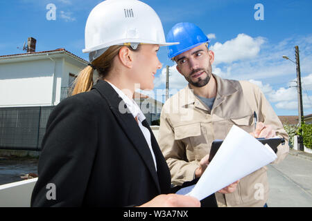 engineer and foreman having a discussion on the site Stock Photo