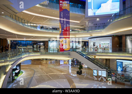 Interior of the O'Plaza shopping mall at OCT Harbour. Shenzhen, Guangdong Province, China. Stock Photo