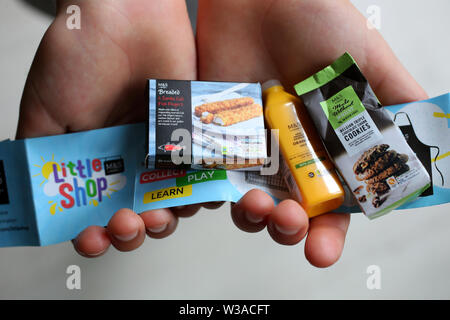 London, UK. 14th July, 2019.  Marks and Spencer Food are facing a public backlash towards their Little Shop campaign as they are giving away tiny (some plastic) products when customers spend £20 on food. Sunday 14th July 2019 © Sam Stephenson/Alamy Live News. Credit: Sam Stephenson/Alamy Live News Stock Photo