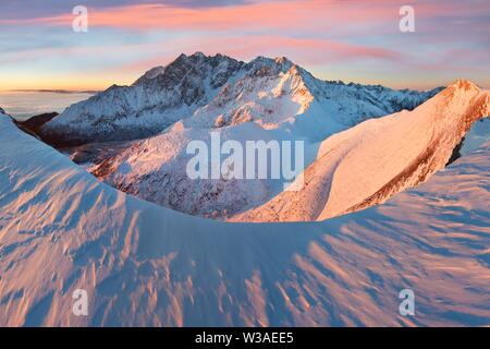 Winter High Tatras mountain range panorama with many peaks and clear sky from Belian Tatras. Sunny day on top of snowy mountains in winter in Slovakia Stock Photo
