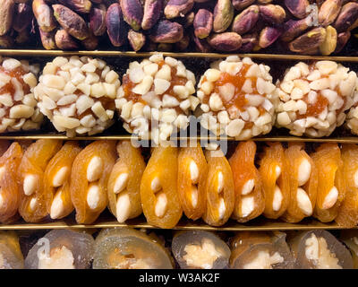 Filled dried fruits (apricot, fig, dates) with nuts, a typical treat and used as a gift in Arabic countries Stock Photo