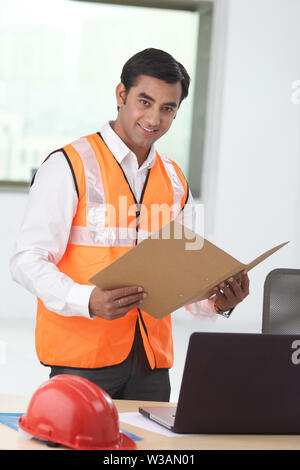 Architect doing paperwork in an office Stock Photo