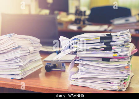 Heap of papers work stack documents on office desk ,business documents billing and examination to report the summary results annual report for Stock Photo