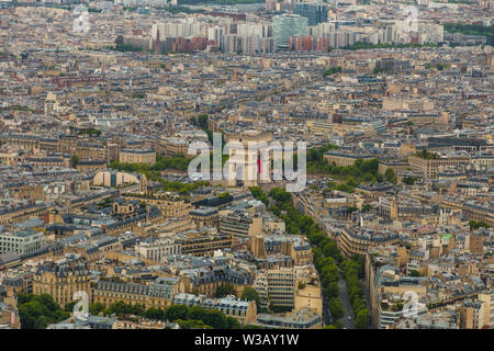 Lovely aerial view of the Arc de Triomphe de l'Étoile and the cityscape of Paris. Streets are leading to the roundabout of which the monument is the...