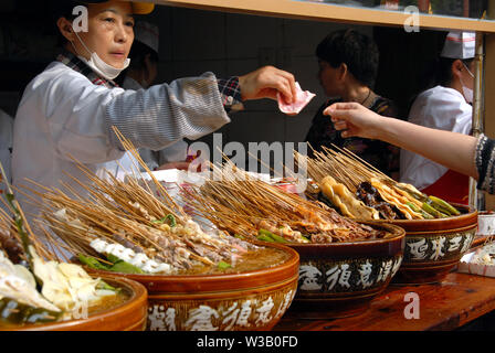 Local Sichuan food on Jinli Street, Chengdu. Strange, weird and bizarre food. Street stall, Chinese food, street food, Jinli Street, Sichuan, China. Stock Photo