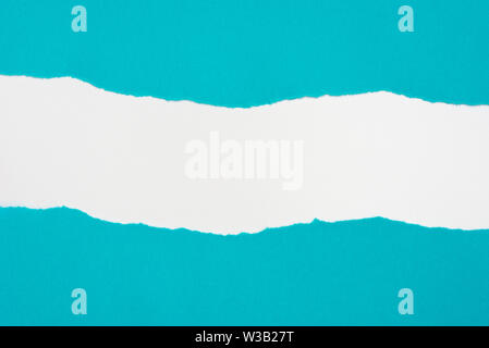 pieces of blue color paper on white background with copy space Stock Photo