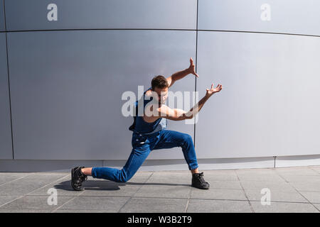 Young handsome man dancer shows contemporary dance Stock Photo