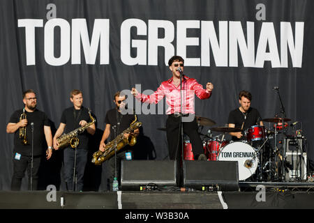 Swansea, UK. 13th July, 2019. Tom Grennan performs on stage. Re: Stereophonics live concert at the Singleton Park in Swansea, Wales, UK. Credit: ATHENA PICTURE AGENCY LTD/Alamy Live News Stock Photo