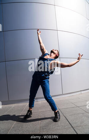 Man doing expressive dancing motion with his arms Stock Photo