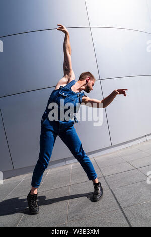 Man doing expressive dancing motion with his arms Stock Photo