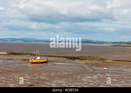 Tide is out in Morecambe Bay in Lancashire, UK exposing sandy seabed. Stock Photo