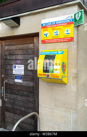 Defibrillator in yellow box with instructions for use Stock Photo