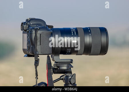 Tele Zoom lens with Camera mounted on the tripod ready for shooting at Desert Winter season. City Dammam Saudi Arabia.Photo taken Month of November -0 Stock Photo