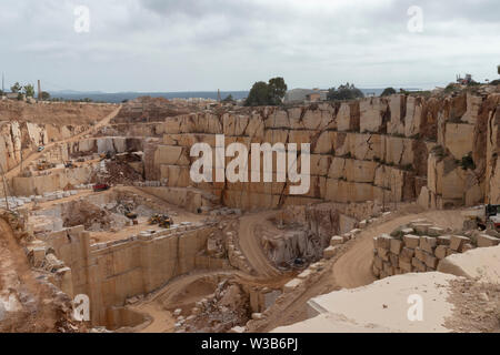 Overhead view of a quarry in Italy, with a number of machines processing slabs of marble. Stock Photo