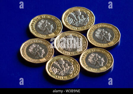 One pound coins with blue background Stock Photo