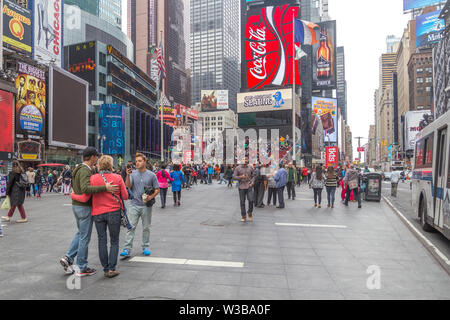 New York City, Ny, USA - October 16, 2013: tourists walking around taking photos and selfies at the Times Square area, Manhattan Stock Photo