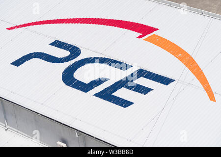 Solina, Poland - June 24, 2019: Polska Grupa Energetyczna (PGE) logo near Solina Dam in Poland. PGE Capital Group is Poland’s largest energy sector co Stock Photo