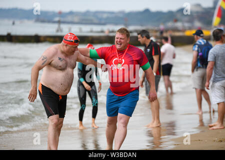 Bournemouth, UK. 14th July 2019. Hundreds of swimmers took to the water for the Bournemouth Pier to Boscombe Pier swim challenge. 2019 marks the 29th anniversary of the event, in aid of the British Heart Foundation. Stock Photo