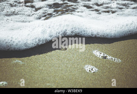 surf in sandy sea beach Stock Photo