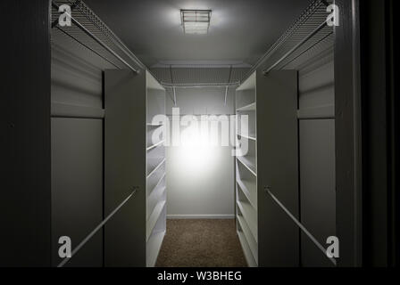 Empty Closet With Glowing Light Stock Photo