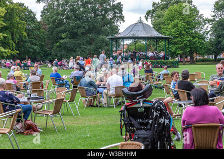 Northampton, UK. 14th July 2019. Light Clouds giving a warmish Sunday afternoon for people in Abington Park having a picknic and enjoy the Band in the Park, which is on every Sunday between 2 to 5 pm, a different band plays each week from April to September, the band today is Corby Steel Band. Credit: Keith J Smith./Alamy Live News. Stock Photo