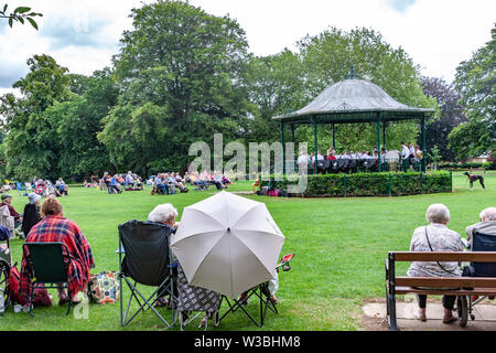 Northampton, UK. 14th July 2019. Light Clouds giving a warmish Sunday afternoon for people in Abington Park having a picknic and enjoy the Band in the Park, which is on every Sunday between 2 to 5 pm, a different band plays each week from April to September, the band today is Corby Steel Band. Credit: Keith J Smith./Alamy Live News. Stock Photo