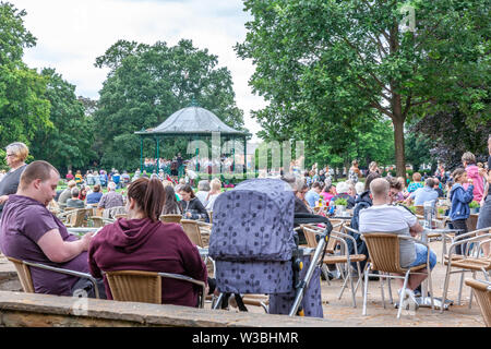 Northampton, UK. 14th July 2019. Light Clouds giving a warmish Sunday afternoon for people in Abington Park having a picknic and enjoy the Band in the Park, which is on every Sunday between 2 to 5 pm, a different band plays each week from April to September, the band today is Corby Steel Band. Credit: Keith J Smith./Alamy Live News. Stock Photo