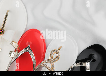 white fabric flip flops