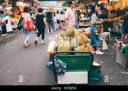 Durian, exotic tropical fruits on sale in market of Hong Kong. Stock Photo