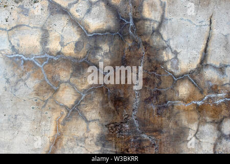 Close-up image of cracked grey concrete Stock Photo