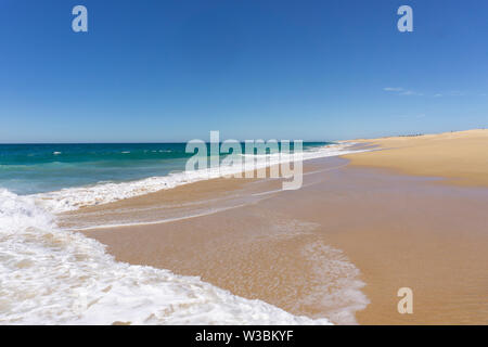 endless sandy beach at the Mexican pacific coast near Todos Santos in Baja California Stock Photo