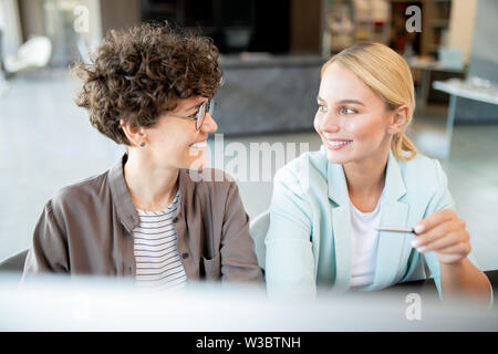 Two young successful managers discussing new ideas Stock Photo