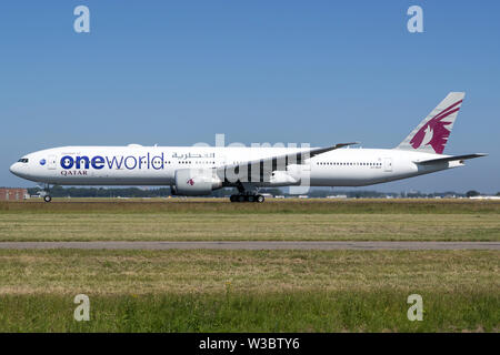 Qatar Airways Boeing 777-300 with registration A7-BAF in special oneworld livery on take off roll on runway 36L of Amsterdam Airport Schiphol. Stock Photo