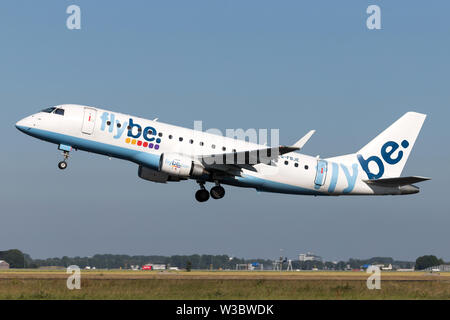 British flybe Embraer ERJ-175 with registration G-FBJE taking off runway 36L (Polderbaan) of Amsterdam Airport Schiphol. Stock Photo
