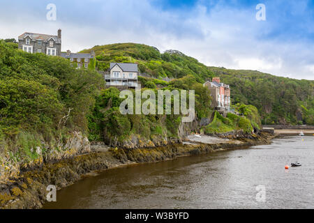 Riverfront houses on the Mawddach estuary at Porth Aberamffra in Barmouth, Gwynedd, Wales, UK Stock Photo