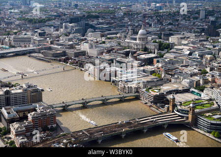 Aerial view from The Shard of central London England with bridges over the muddy River Thames and St Paul's Cathedral Anglican church Stock Photo