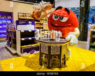 M&M mascot figure pouring Turkish coffee in a mug. Adaption of candy advertising of the company MARS for different regions and countries. Istanbul, Tu Stock Photo